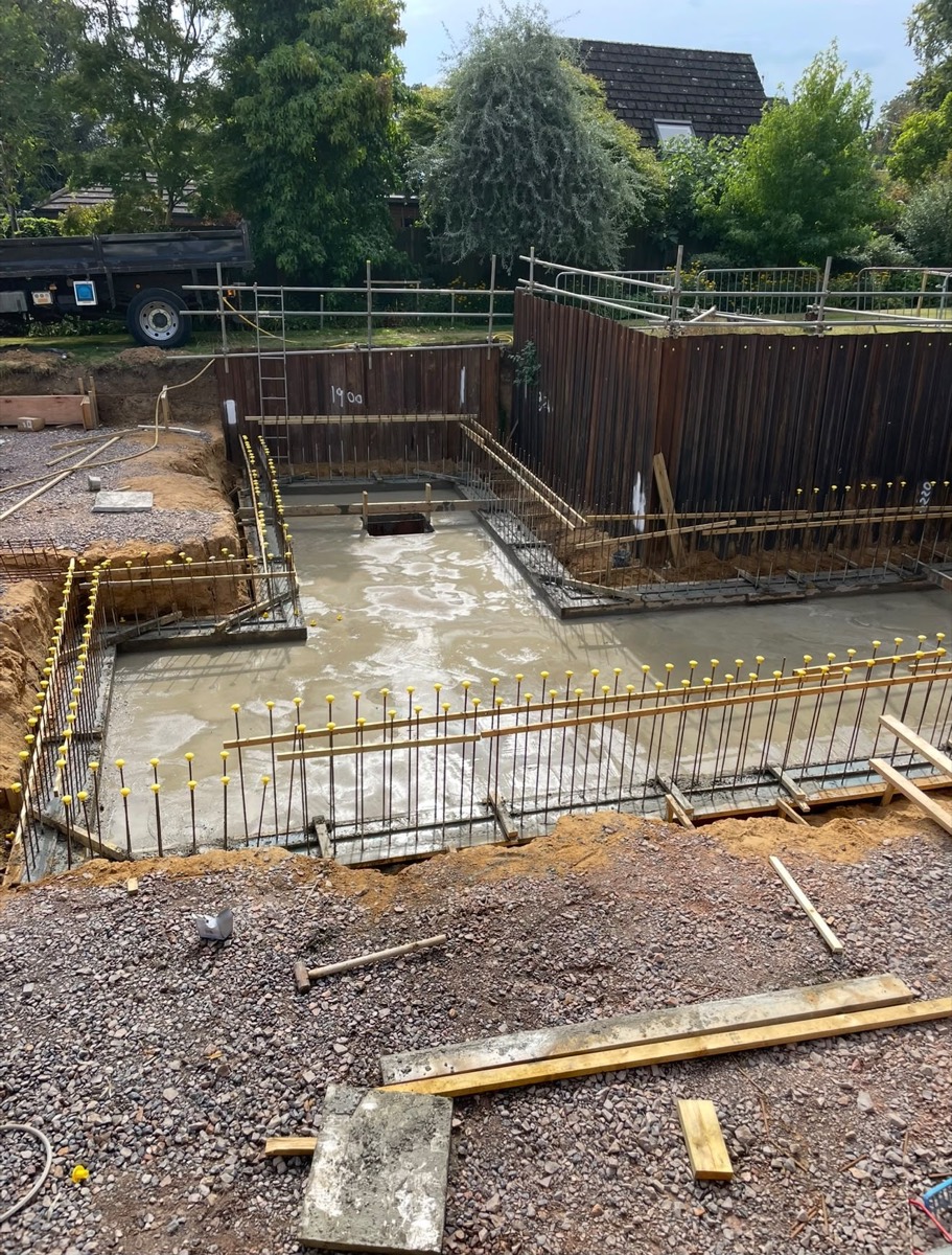 Basement slab poured with sheet piling and vertical rebar