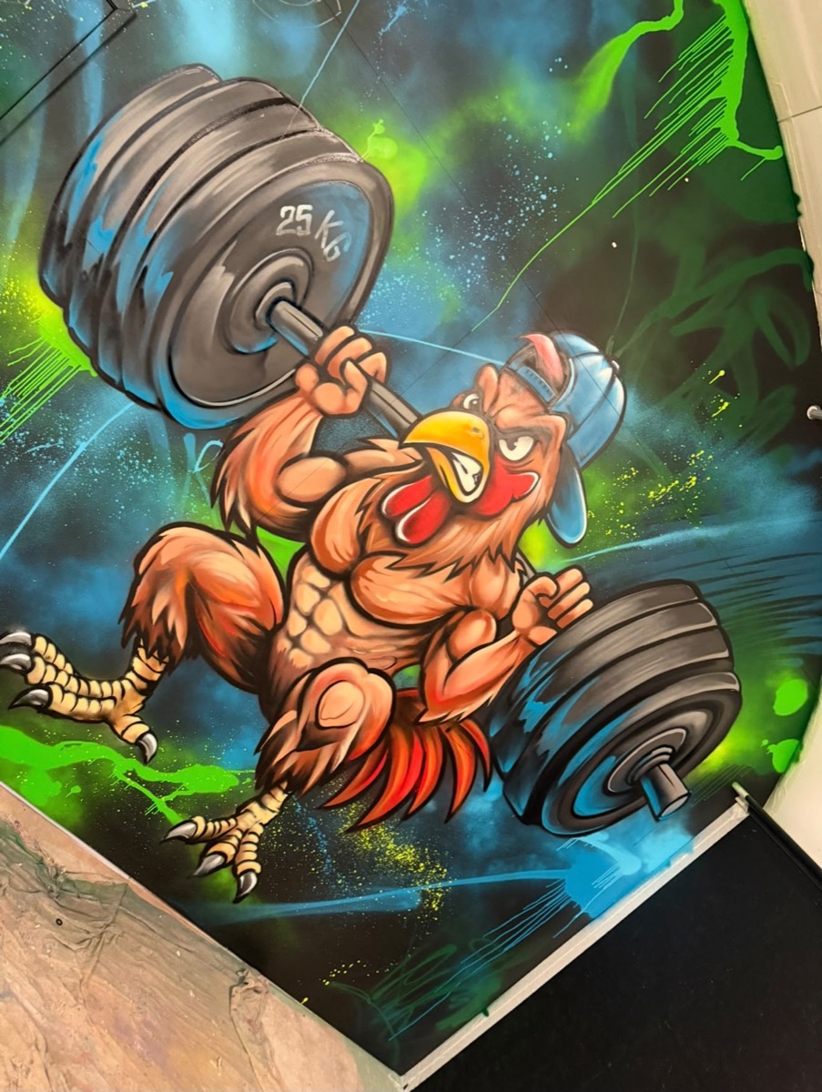 Finished weightlifting chicken graffiti mural